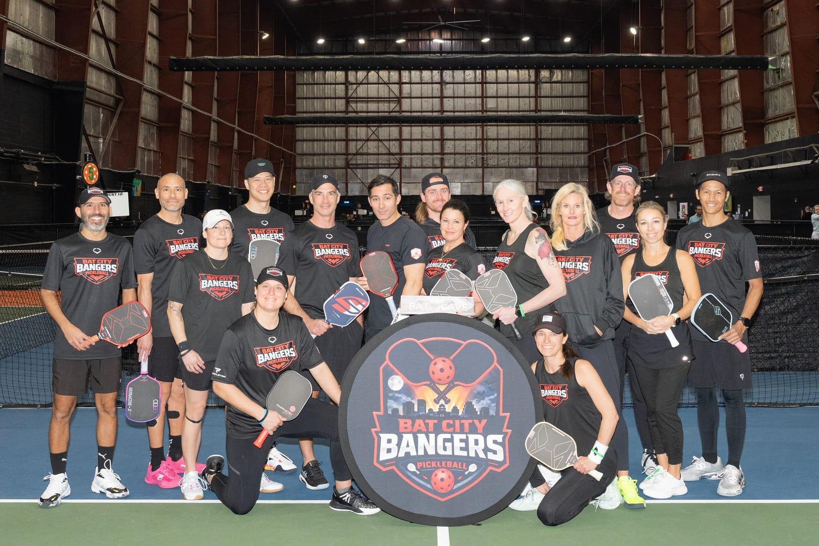 Bat City Bangers team posing with paddles on court