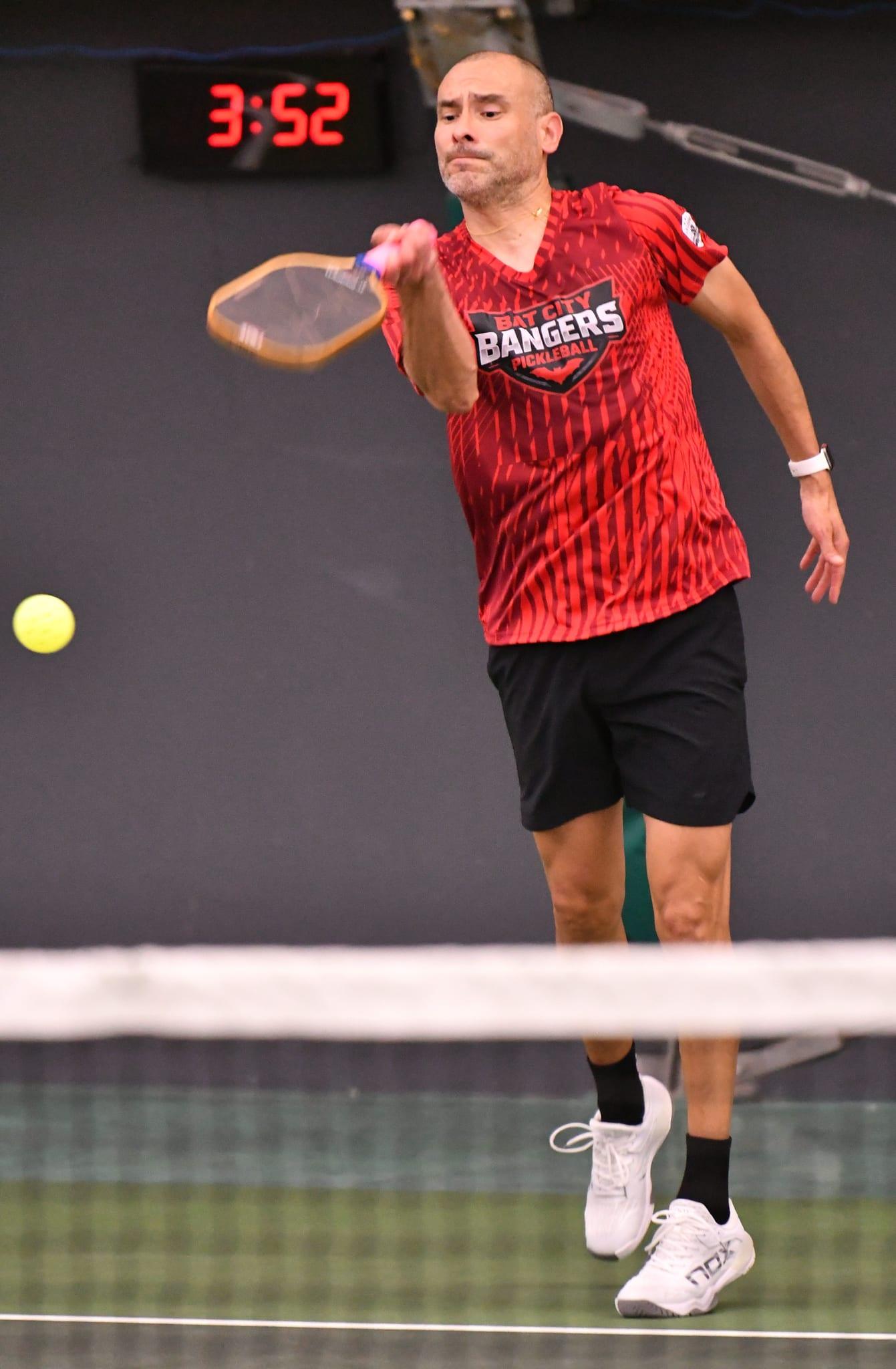 Guillermo Tolaba mid-swing